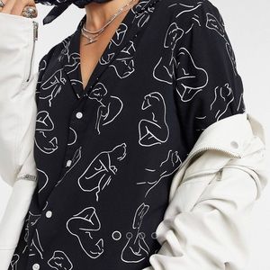 Men’s deep revere scribble body print shirt in black by ASOS Design. Size M